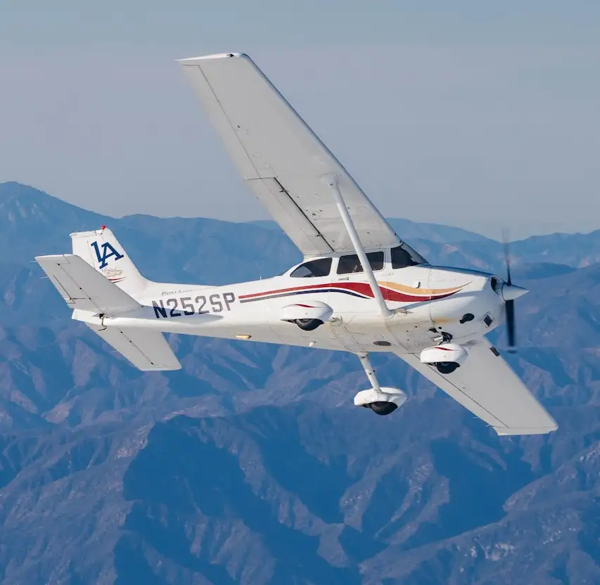 Instructor demonstrating spin recovery techniques to a pilot