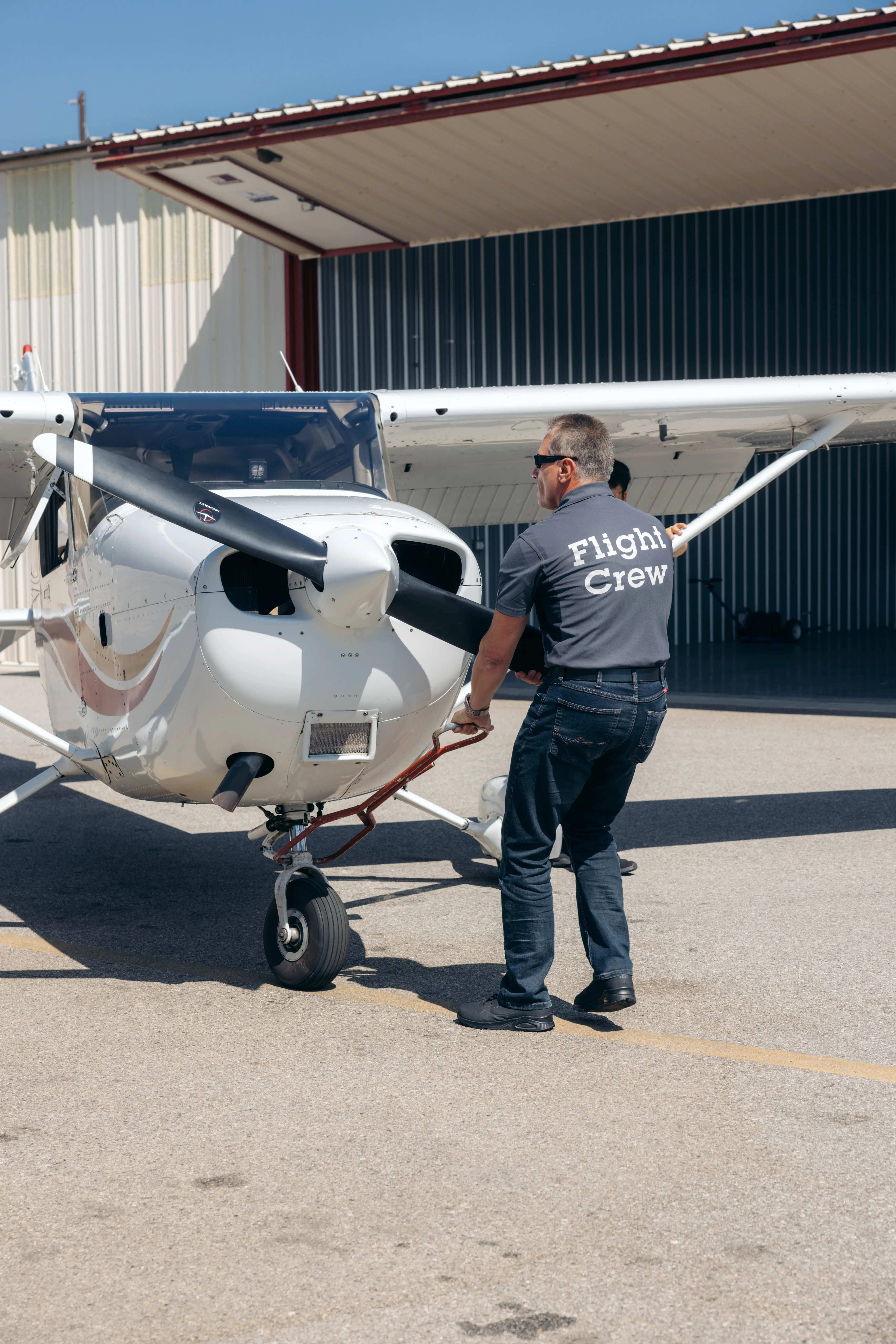 LAFA staff taking out plane for flight